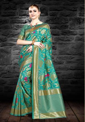 Look Pretty Draping This Saree In Sea Green Color Paired With Sea Green Colored Blouse. This Saree And Blouse Are Fabricated On Art Silk Beautified With Weave All Over. 