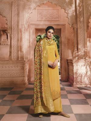 Add This Trendy Designer Suit To Your Wardrobe In Yellow Color. This Pretty Stone Embroidered Straight Suit Is Crepe Based Paired With Jacquard silk Fabricated Dupatta. Its Fabric Is Light Weight And Easy To Carry All Day Long.