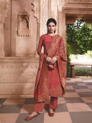 New Shade Is Here To Add Into Your Wardrobe With This Pretty Designer Straight Suit In Rust Red Color. It Top and Bottom Are Crepe Based Paired With Attractive Jacquard Silk Fabricated Dupatta. 