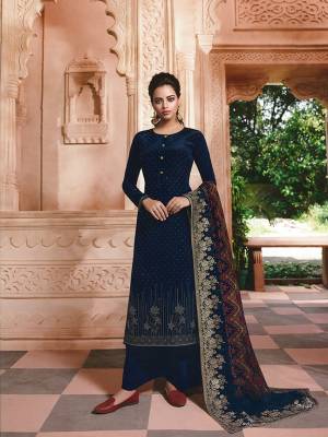 Enhance Your Personality Wearing This Rich And Elegant Looking Straight Suit In Navy Blue Color. Its Top And Bottom Are Fabricated On Crepe Paired With Jacquard Silk Fabricated Dupatta. Buy Now.