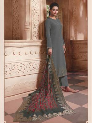 Add This Trendy Designer Suit To Your Wardrobe In Grey Color. This Pretty Stone Embroidered Straight Suit Is Crepe Based Paired With Jacquard silk Fabricated Dupatta. Its Fabric Is Light Weight And Easy To Carry All Day Long.