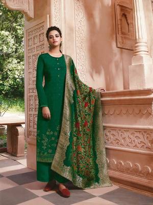 Here Is A Very Pretty Designer Straight Suit In Green Color. Its Stone Embroidered Top Is Fabricated On Crepe Paired With Crepe Bottom And Jacquard Silk Fabricated Dupatta. Buy This Pretty Suit Now.