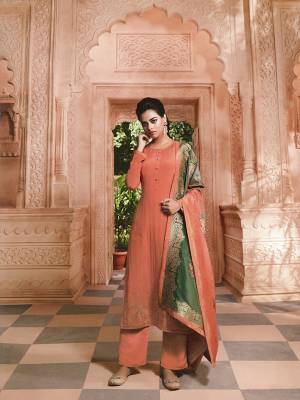 New Shade Is Here To Add Into Your Wardrobe With This Pretty Designer Straight Suit In Dark Peach Color. It Top and Bottom Are Crepe Based Paired With Attractive Jacquard Silk Fabricated Dupatta. 