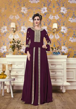 Here Is A New And Unique Patterned Designer Readymade Gown In Wine Color. This Pretty Gown Is Fabricated On Georgette Beautiufied With Attractive Detailed Embroidery. You Will Definitely Earn Lots Of Compliments In This Lovely Puplum Patterned Designer Gown. 