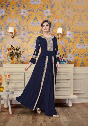 Here Is A New And Unique Patterned Designer Readymade Gown In Navy Blue Color. This Pretty Gown Is Fabricated On Georgette Beautiufied With Attractive Detailed Embroidery. You Will Definitely Earn Lots Of Compliments In This Lovely Puplum Patterned Designer Gown. 