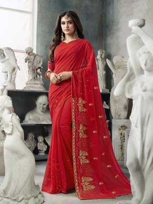 Celebrate This Festive Season With Beauty And Comfort Wearing This Pretty Elegant Designer Saree In Red Color. This Saree And Blouse Are Fabricated On Georgette Beautified With Jari Embroidery And Tone To Tone Resham Work. Buy Now.