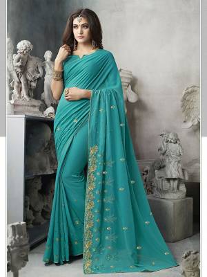 For Your Semi-Casual Wear, Grab This Pretty Saree In Blue Color. This Saree And Blouse Are Georgette Based With A Minimal Of Embroidery Work With Jari And Tone To Tone Resham. 