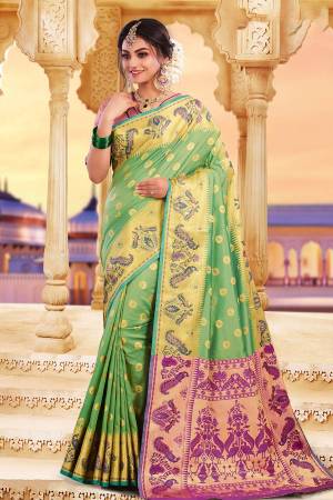 Adorn A Rich Look Wearing This Designer Saree In Green Color Paired With Contrasting Dark Pink Colored Blouse. This Saree and Blouse Are Fabricated On Art Silk Beautified With Attractive Weave. Buy Now