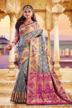 Celebrate This Festive Season With Beauty And Comfort Wearing This Pretty Silk Based Saree In Grey Color Paired With Contrasting Dark Pink Colored Blouse. This Saree And Blouse Are Fabricated On Art Silk Beautified With Weave.