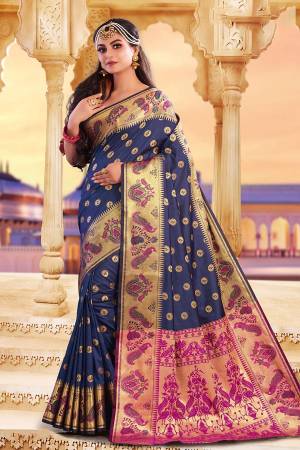Adorn A Rich Look Wearing This Designer Saree In Navy Blue Color Paired With Contrasting Dark Pink Colored Blouse. This Saree and Blouse Are Fabricated On Art Silk Beautified With Attractive Weave. Buy Now
