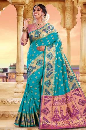 Celebrate This Festive Season With Beauty And Comfort Wearing This Pretty Silk Based Saree In Sky Blue Color Paired With Contrasting Pink Colored Blouse. This Saree And Blouse Are Fabricated On Art Silk Beautified With Weave.
