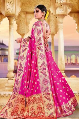 Adorn A Rich Look Wearing This Designer Saree In Rani Pink Color Paired With Rani Pink Colored Blouse. This Saree and Blouse Are Fabricated On Art Silk Beautified With Attractive Weave. Buy Now