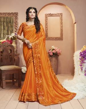 Grab This Pretty Attractive Saree In Orange Color Paired With Orange Colored Blouse. This Saree Is Fabricated On Satin Silk Paired With Brocade Fabricated Blouse. Its Rich Fabric And Color Will Earn You Lots Of Compliments From Onlookers.