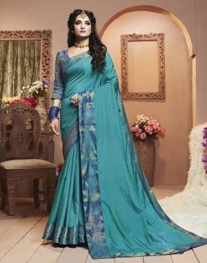 Grab This Pretty Attractive Saree In Blue Color Paired With Blue Colored Blouse. This Saree Is Fabricated On Satin Silk Paired With Brocade Fabricated Blouse. Its Rich Fabric And Color Will Earn You Lots Of Compliments From Onlookers.
