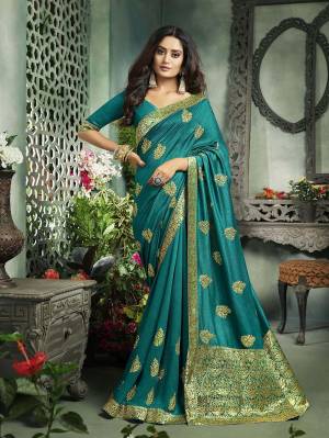 You Will Definitely Earn Lots Of Compliments Wearing This Rich Designer Saree In Blue Color. This Saree And Blouse Are Silk Based Beautified With Jari Embroidery and Weaved Border. Buy This Saree Now.