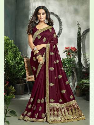 Flaunt Your Rich And Elegant Taste In This Pretty Wine Colored Saree. This Saree And Blouse Are Fabricated On Art Silk Beautified With Broad Weaved Lace Border And Jari Embroidered Motifs. 