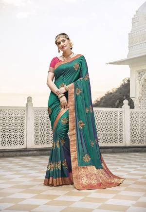 Attract All Wearing This Designer Saree In Blue Color Paired With Contrasting Pink Colored Blouse. This Saree Is Fabricated On Satin Silk Paired With Art Silk Fabricated Blouse. It Is Beautified With Embroidered Motifs And Lace Border. 