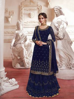 Grab This Designer Heavy Suit In Navy Blue Color For The Upcoming Wedding And Festive Season. This Whole Suit Is Georgette Based Beautified With Heavy Tone To Tone Thread Embroidery With Jari Work. 