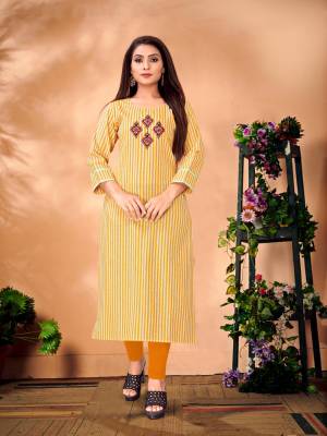 Here Is A Very Pretty Designer Readymade Kurti In Musturd Yellow & White Color Fabricated On Cotton. It Is Beautified With Striped Prints And Thread Work. 
