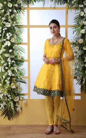 Celebrate This Festive Season With Beauty And Comfort Wearing This Designer Suit In Yellow Color. Its Top Is Fabricated On Art Silk Paired With Santoon Bottom And Net Fabricated Dupatta. 
