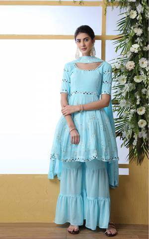 Here Is A Very Pretty Designer Sharara Suit In Sky Blue Color. Its Pretty Top and Bottom Are Georgette Based Paired With Georgette Fabricated Dupatta. It Is Beautified With Tone To Tone Embroidery With Mirror Work. 