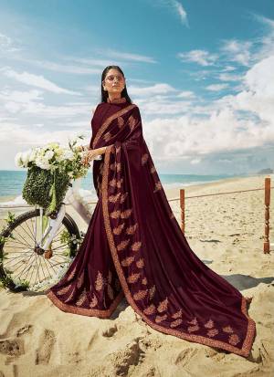 Grab This Beautiful Designer Saree For The Upcoming Festive And Wedding Season In Wine Color. This Saree And Blouse Are Silk based Which Gives A Rich Look To Your Personality. 