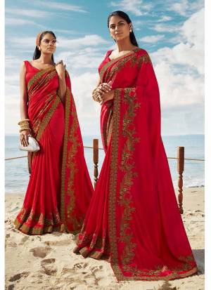 Celebrate This Festive Season Wearing This Designner Saree In Red Color. This Saree And Blouse Are Silk Based Beautified With Detailed Embroidery. Buy Now.
