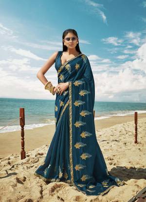 Grab This Beautiful Designer Saree For The Upcoming Festive And Wedding Season In Blue Color. This Saree And Blouse Are Silk based Which Gives A Rich Look To Your Personality. 