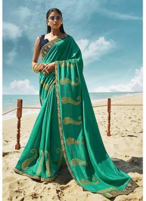 Grab This Beautiful Designer Saree For The Upcoming Festive And Wedding Season In Sea Green Color Paired With Contrasting Navy Blue Colored Blouse.. This Saree And Blouse Are Silk based Which Gives A Rich Look To Your Personality. 