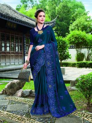 Enhance Your Personality In This Tone To Tone Heavy Embroidered Saree In Blue Color. Its Rich Color And Fabric Will Definitely Earn You Lots Of Compliments From Onlookers. 