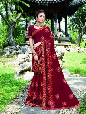 Bright And Visually Appealing Color IS Here With This Designer Saree In Maroon Color. This Saree Is Beautified With Detailed Embroidery Giving An Attractive Look.