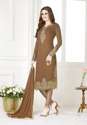 Add This Beautiful Designer Straight Suit To Your Wardrobe In Light Brown Color. Its Top Is Fabricated On Georgette Paired With Santoon Bottom And Chiffon Dupatta. Its Fabric Is Light In Weight And Easy To Carry All Day Long