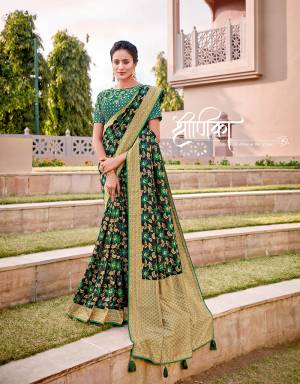 Adorned with the lotus motif, this earthy-green colored saree defines grace and grandeur alike. Keep the jewels minimal but graceful. 