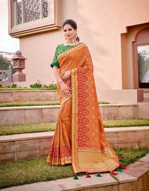 An excellent combination of Indian saffron and fresh green , this saree is the essence of the Indian culture. Wear it in any Indian drape , you are bound to look beautiful.