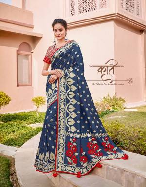 An artistic take on traditional silk saree, this royal blue and red design is appealing and attractive. Pair with meenakari jewels for a memorable look. 