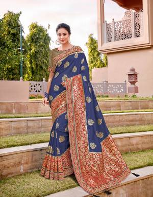 This modest and refined blue saree paired with royal brocade and combined with a hint of delicate embroidery will make your ethnic soul flutter with joy. Drape in a classic nivi drape and look mesmerizing. 