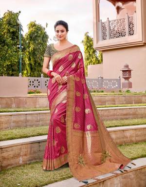 Brighten up your festivities in this vibrant rani pink saree with enhanced short pallu . Drape in a half falling pallu style tp enhance the beauty of the saree. 