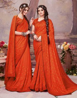Here Is A Very Pretty Designer Saree In Orange Color For The Upcoming Festive Season. This Saree Is Fabricated On Soft Art Silk Paired With Art Silk Fabricated Blouse. It Is Beautified With Embroidered Buttis All Over. Buy Now.