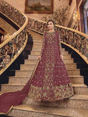 Wear This Heavy Designer suit In Two Looks With This Beautiful Maroon Colored Floor Length Suit Paired With A Net Fabricated Embroidered Jacket, Art Silk Fabricated Bottom And Net Fabricated Dupatta. You Can Wear This With Or Without Jacket As Per The Ocaasion. 