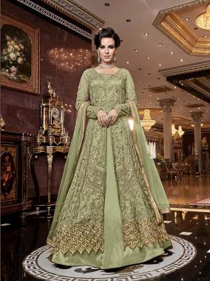 Rich And Elegant Looking Designer Indo-Western Suit Is Here In Light Green Which Comes With Two Bottoms. Its Heavy Embroidered Top Is Fabricated On Net Paired With Satin Fabricated Embroidered Bottom , A Satin Fabricated Lehenga And Net Fabricated Dupatta. All Its Fabrics Are Light Weight And Easy To Carry Throughout The Gala.