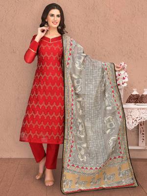 For Your Semi-Casual Wear, Grab This Designer Straight Suit In Red Color Paired With Grey Colored Dupatta. Its Lovely Top and Dupatta Are Fabricated On Chanderi Silk Paired With Cotton Based Bottom. 