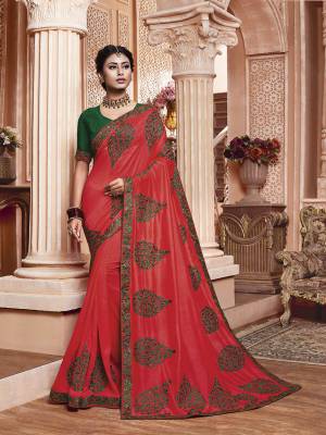 Get Ready For The Upcoming Wedding And Festive Season With This Designer Saree In Dark Pink Color Paired With Contrasting Green Colored Blouse. This Contrasting Embroidered Saree Is Fabricated On Vichitra Silk Paired With Art Silk Fabricated Blouse.