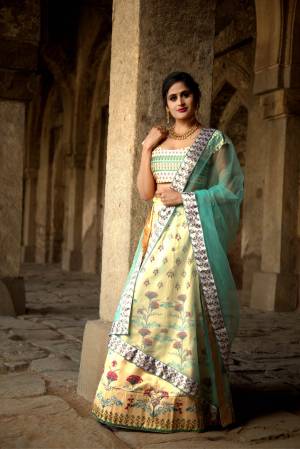 Rich And Elegant Looking Digital Printed Designer Lehenga Choli Is Here In Light Yellow & Sky Blue Color. This Pretty Lehenga Choli Is Satin Based Paired With Net Fabricated Dupatta. Its abric Is Soft Towards Skin And Easy To Carry Throughout The Gala. 