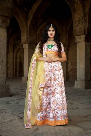 Rich And Elegant Looking Digital Printed Designer Lehenga Choli Is Here In Off-White & Light Yellow Color. This Pretty Lehenga Choli Is Satin Based Paired With Net Fabricated Dupatta. Its abric Is Soft Towards Skin And Easy To Carry Throughout The Gala. 