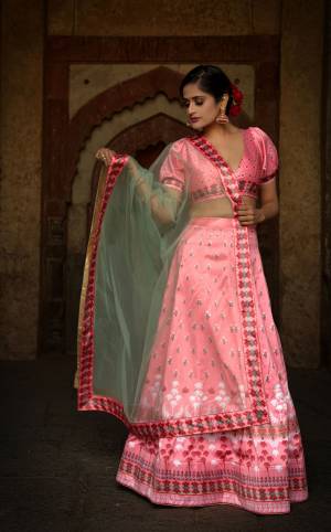 Rich And Elegant Looking Digital Printed Designer Lehenga Choli Is Here In Pink And Pastel Green Color. This Pretty Lehenga Choli Is Satin Based Paired With Net Fabricated Dupatta. Its abric Is Soft Towards Skin And Easy To Carry Throughout The Gala. 