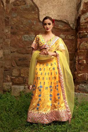 Look Pretty In This Designer Yellow Colored Lehenga Choli. Its Lovely Digital Printed Blouse And Lehenga Are Satin Based Paired With Red Fabricated Dupatta. Buy This Pretty Piece Now.
