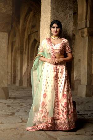 Rich And Elegant Looking Digital Printed Designer Lehenga Choli Is Here In Peach & Pastel Green Color. This Pretty Lehenga Choli Is Satin Based Paired With Net Fabricated Dupatta. Its abric Is Soft Towards Skin And Easy To Carry Throughout The Gala. 