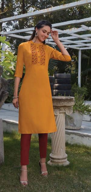 Grab This Readymade Straight Kurti In Musturd Yellow Color Fabricated On Rayon. It Is Beautified With Pretty Elegant Minimal Thread Embroidery. You Can Pair This Up With Same Or Contrasting Colored Leggings Or Pants. 