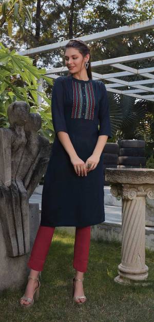 Grab This Readymade Straight Kurti In Navy Blue Color Fabricated On Rayon. It Is Beautified With Pretty Elegant Minimal Thread Embroidery. You Can Pair This Up With Same Or Contrasting Colored Leggings Or Pants. 