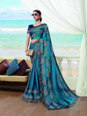 Catch All The Limelight Wearing This Bright And Appealing Designer Saree In Blue Color. This Saree IS Chinon Based Paired With Art Silk Fabricated Blouse. Buy this Lovely Piece Now.
